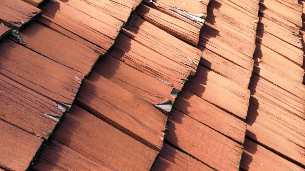 orange stain starting peeling off on cedar shake roof